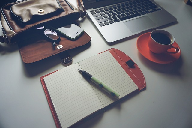 journal and pen for discipline habit tracking in dark minimalist workspace