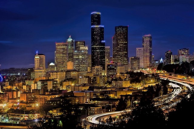 confident ambitious people in modern European business environment night city lights